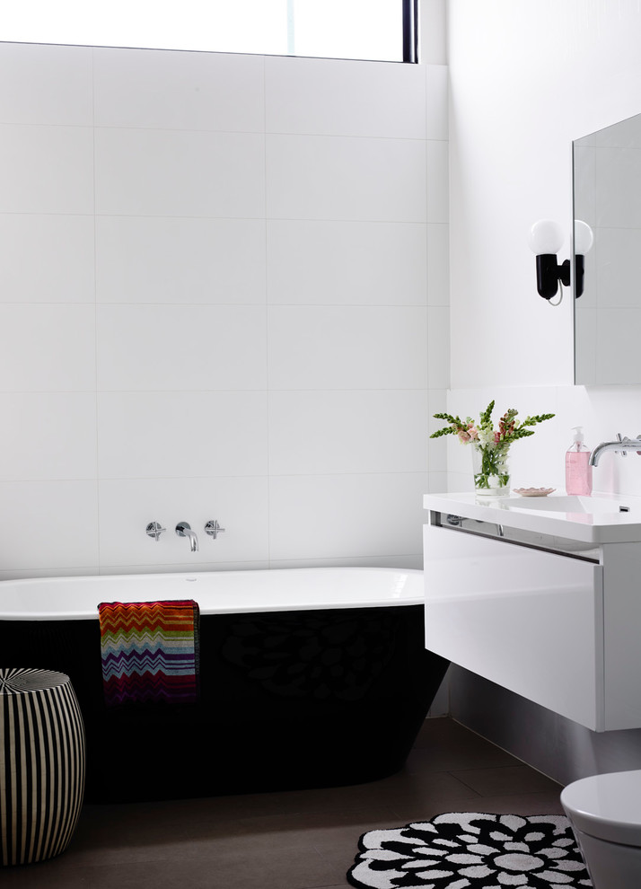 Photo of a mid-sized contemporary bathroom in Melbourne with a freestanding tub.