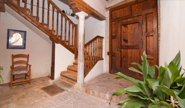 Design ideas for a mid-sized country u-shaped staircase in Other.