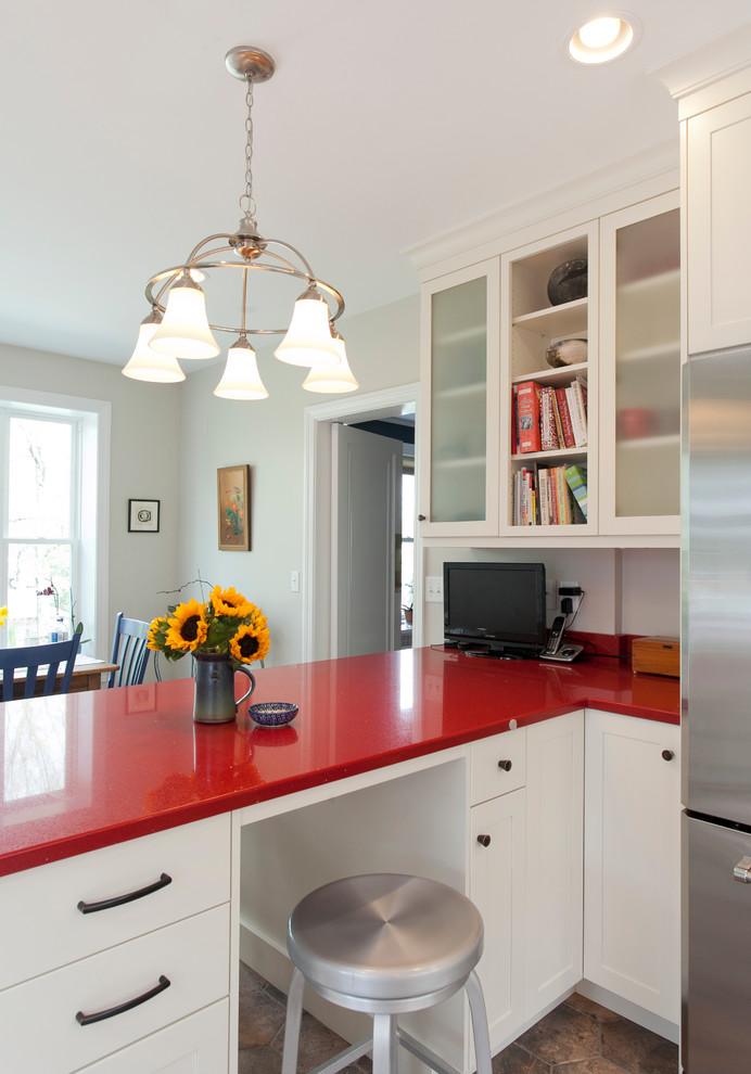 Design ideas for a scandinavian eat-in kitchen in Bridgeport with an undermount sink, shaker cabinets, white cabinets, quartz benchtops, white splashback, ceramic splashback, stainless steel appliances, porcelain floors, a peninsula and red benchtop.