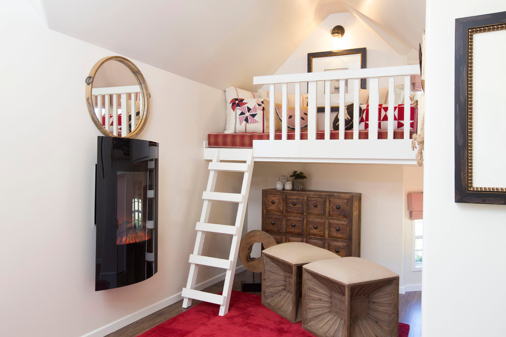 This is an example of a small traditional kids' playroom for kids 4-10 years old and girls in Phoenix with dark hardwood floors.