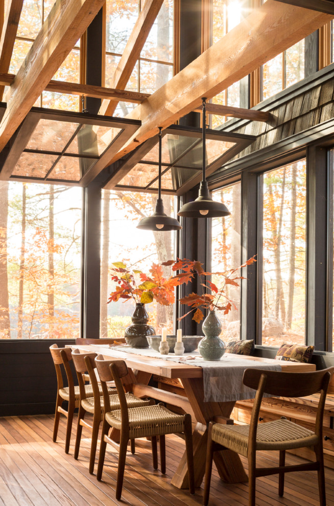 Inspiration for a mid-sized rustic medium tone wood floor and brown floor dining room remodel in Portland Maine