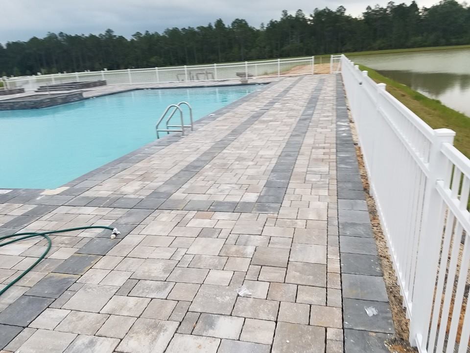 Large transitional backyard stone and custom-shaped natural hot tub photo in Miami