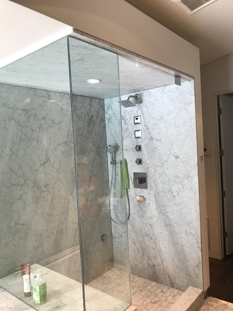 Design ideas for a mid-sized contemporary master bathroom in Phoenix with a drop-in tub, a corner shower, a two-piece toilet, white tile, marble, white walls, marble floors, a drop-in sink, laminate benchtops, white floor, an open shower and grey benchtops.