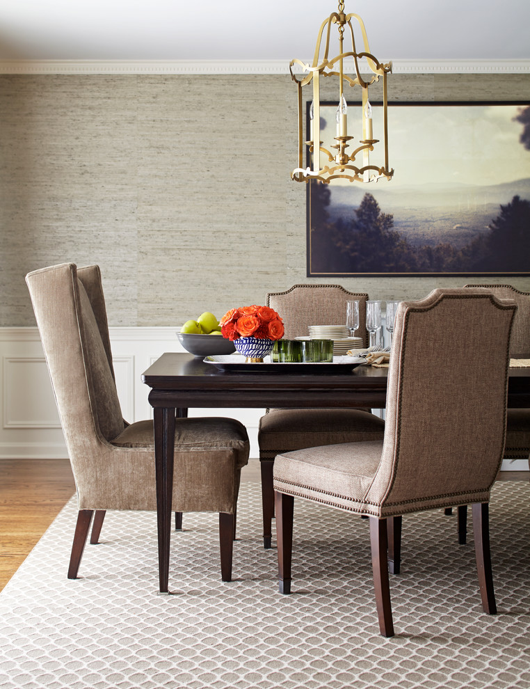 Photo of a traditional dining room in New York with grey walls and medium hardwood floors.