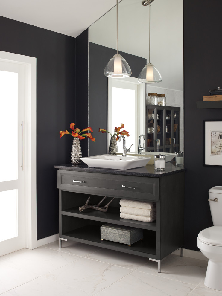 Large modern 3/4 bathroom in Other with black cabinets, marble floors, recessed-panel cabinets, a two-piece toilet, blue walls, limestone benchtops and a vessel sink.