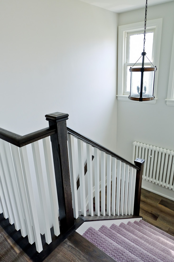 Mid-sized transitional carpeted u-shaped staircase photo in Toronto with carpeted risers