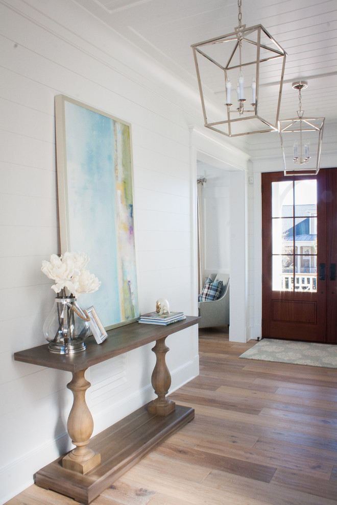 Mid-sized beach style foyer in Charleston with white walls, a double front door and a medium wood front door.