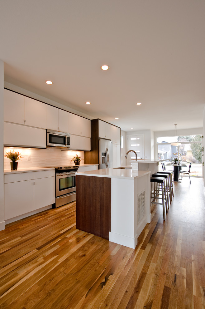 This is an example of a mid-sized modern kitchen in Denver.