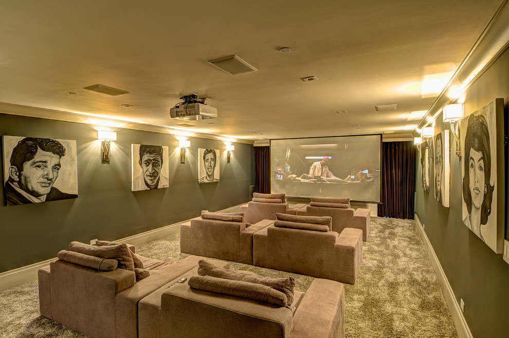 Photo of a contemporary home theatre in Los Angeles with a projector screen and grey floor.