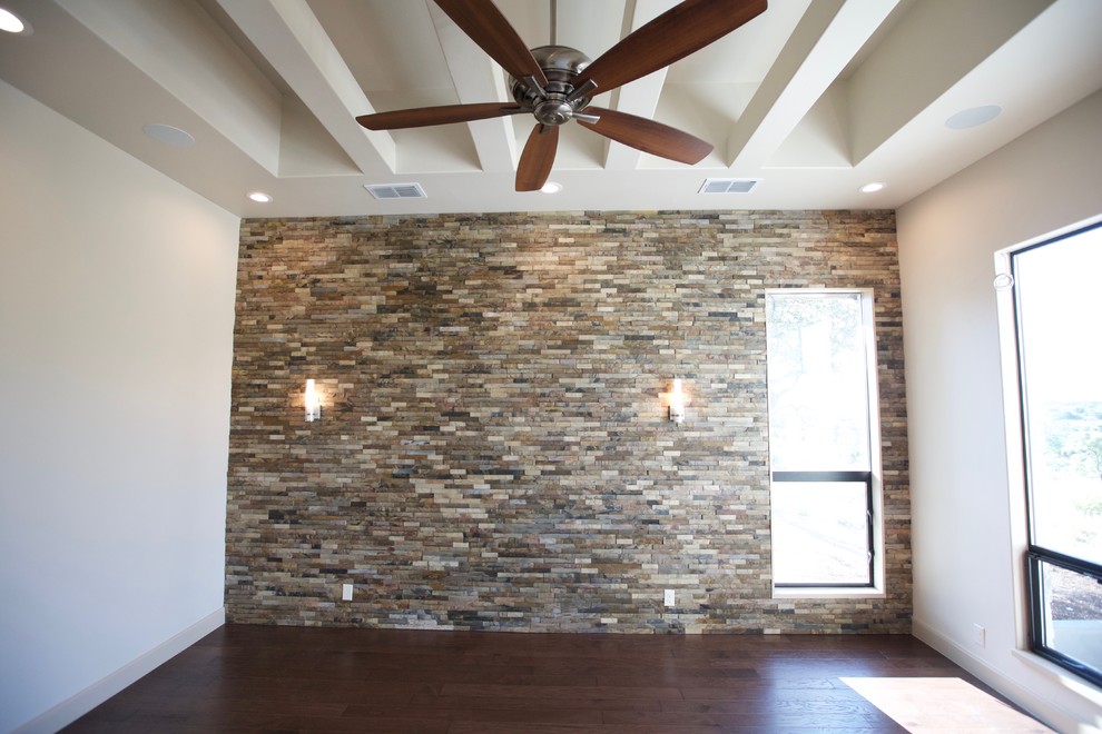 Example of a transitional bedroom design in Austin