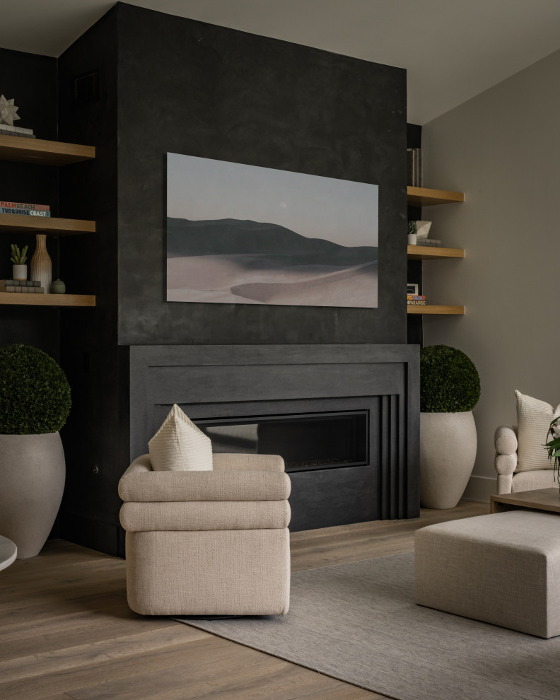 Design ideas for an expansive modern formal open concept living room in Los Angeles with black walls, slate floors, a standard fireplace, a plaster fireplace surround and beige floor.