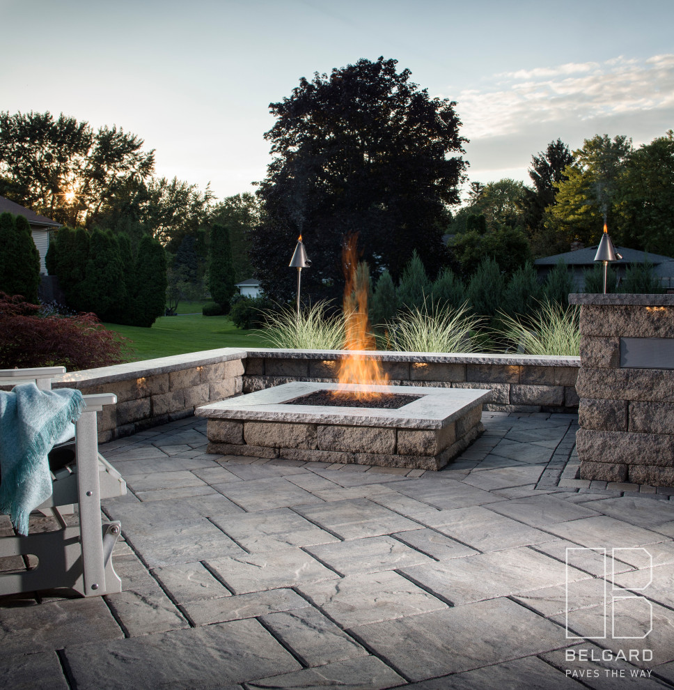 Inspiration for a small traditional backyard patio in New York with a fire feature and concrete pavers.