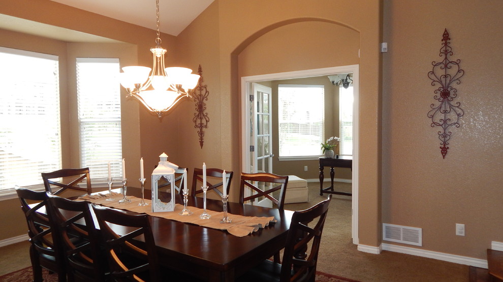 Example of a transitional dining room design in Denver