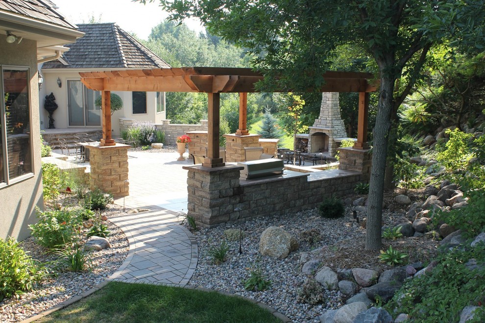 Example of a large transitional backyard concrete paver patio design with a fire pit and no cover