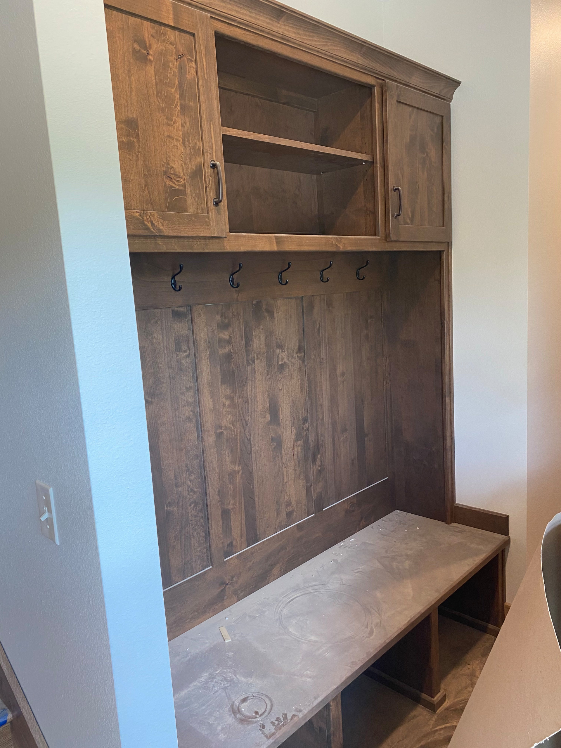 Custom stained mudroom bench with storage