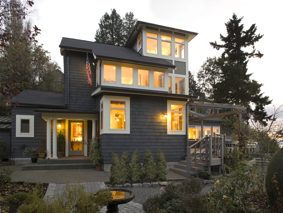 Photo of a mid-sized beach style two-storey exterior in Seattle with wood siding.