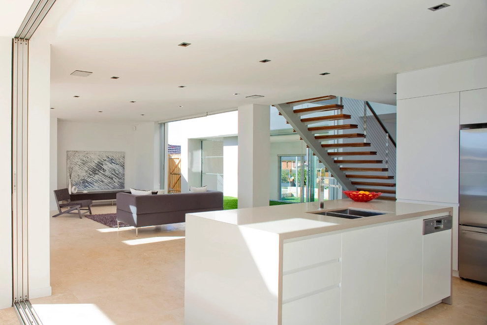 Expansive contemporary family room in Sydney with beige floor.