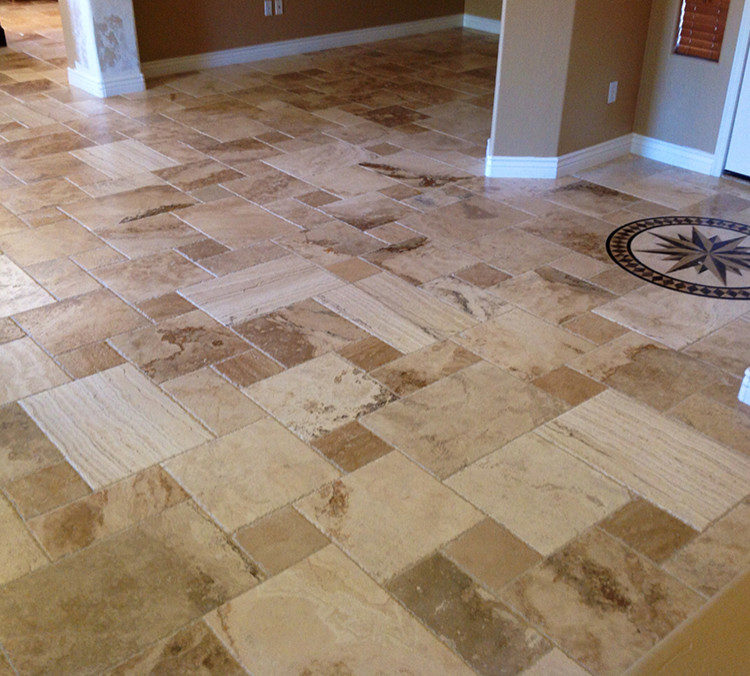 This is an example of a transitional entryway in Phoenix with brown walls, travertine floors and brown floor.
