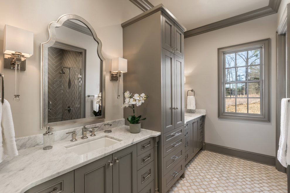 Inspiration for a mid-sized traditional master bathroom in Other with recessed-panel cabinets, beige walls, mosaic tile floors, an undermount sink, marble benchtops, beige floor, white benchtops, a double vanity, a built-in vanity and grey cabinets.