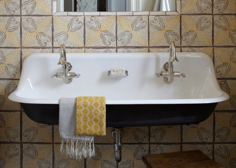 This is an example of a traditional bathroom in Dallas with gray tile, white tile, yellow tile and a wall-mount sink.