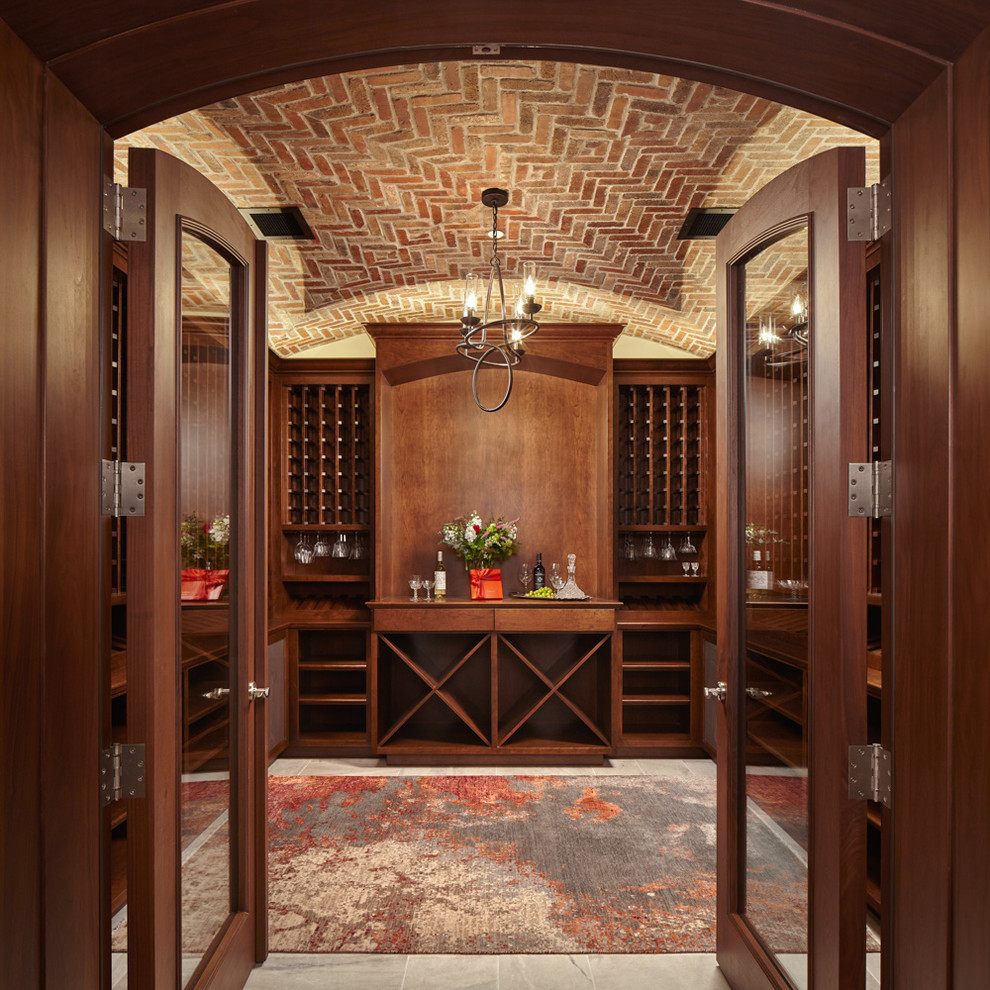 This is an example of a traditional wine cellar in San Francisco with storage racks and grey floor.
