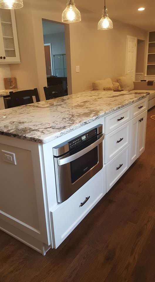 Eat-in kitchen - large transitional u-shaped dark wood floor eat-in kitchen idea in Baltimore with shaker cabinets, white cabinets, stainless steel appliances and an island
