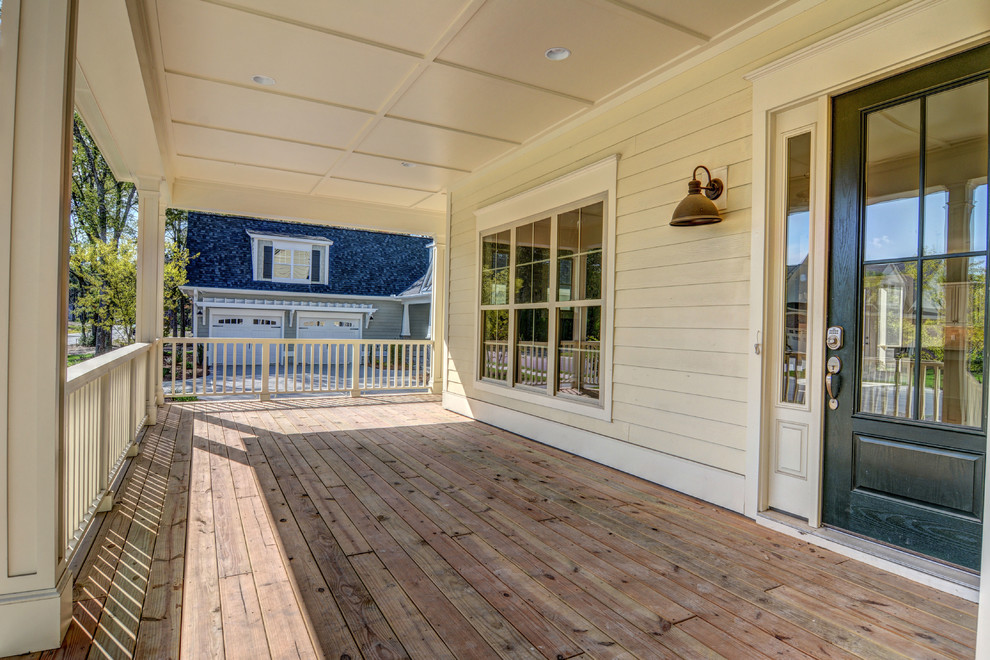 Photo of a mid-sized beach style front yard verandah in Wilmington.