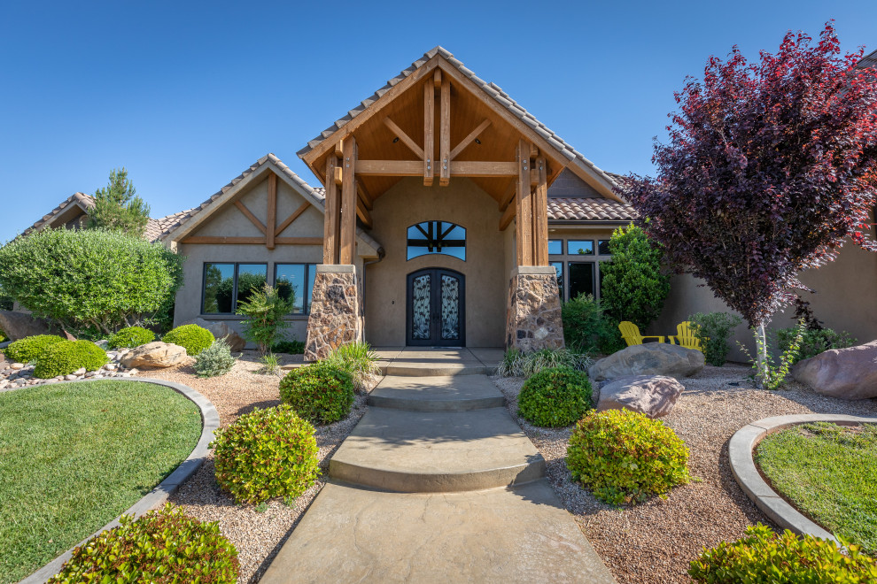Example of a mountain style double front door design with a metal front door