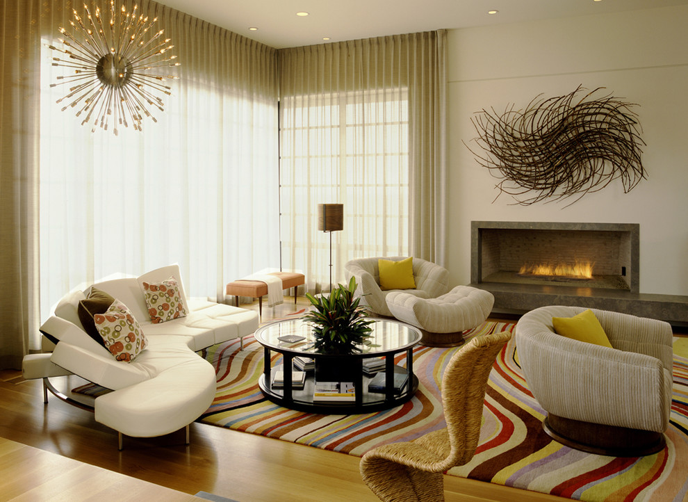 Large contemporary living room in Orange County with beige walls and a ribbon fireplace.