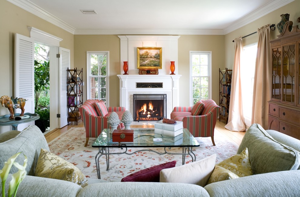 Traditional enclosed living room in Los Angeles with beige walls and a standard fireplace.