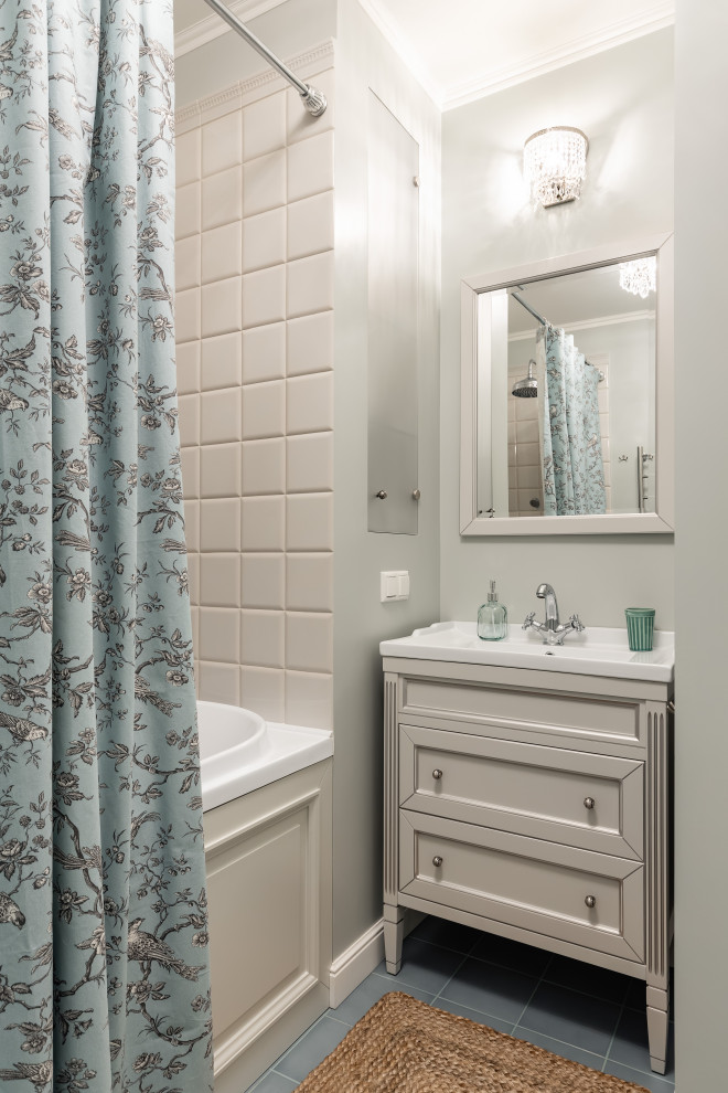 Design ideas for a small traditional master bathroom in Saint Petersburg with recessed-panel cabinets, light wood cabinets, a shower/bathtub combo, a wall-mount toilet, white tile, ceramic tile, white walls, ceramic floors, a drop-in sink, turquoise floor and a shower curtain.