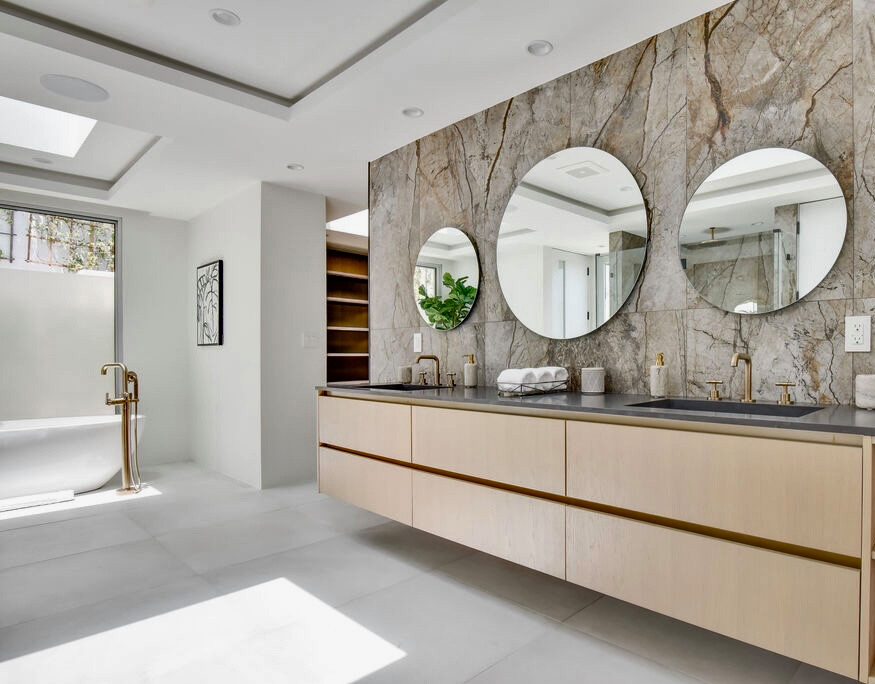 Example of a huge trendy master multicolored tile and stone slab double-sink, porcelain tile, gray floor and tray ceiling bathroom design in Los Angeles with flat-panel cabinets, light wood cabinets, an undermount sink, marble countertops, a hinged shower door, gray countertops, a floating vanity, a wall-mount toilet and white walls