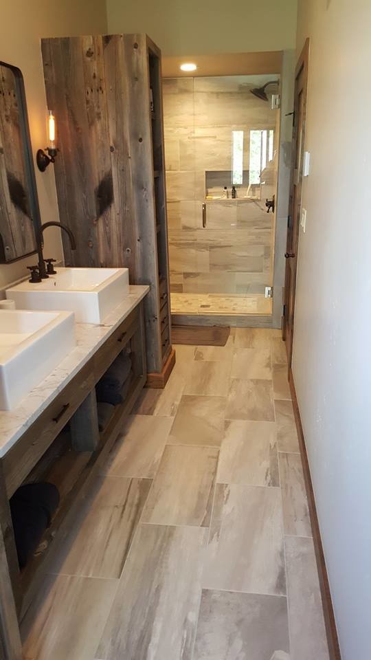 Mid-sized contemporary master bathroom in Denver with flat-panel cabinets, distressed cabinets, a corner shower, brown walls, a vessel sink and marble benchtops.