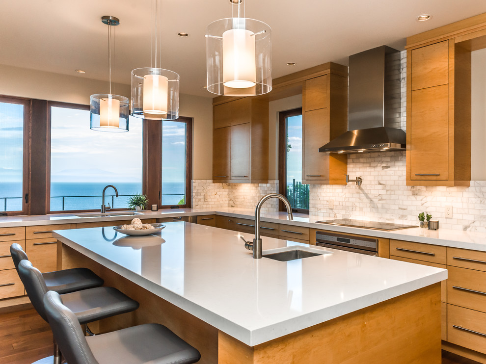 Photo of a contemporary kitchen in Vancouver with an undermount sink, flat-panel cabinets, medium wood cabinets, beige splashback and stainless steel appliances.