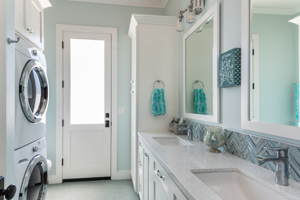 Photo of a small farmhouse family bathroom in San Francisco with shaker cabinets, white cabinets, a one-piece toilet, blue walls, a submerged sink, engineered stone worktops, a wall niche, double sinks, a built in vanity unit, blue tiles, glass tiles, ceramic flooring, blue floors and grey worktops.
