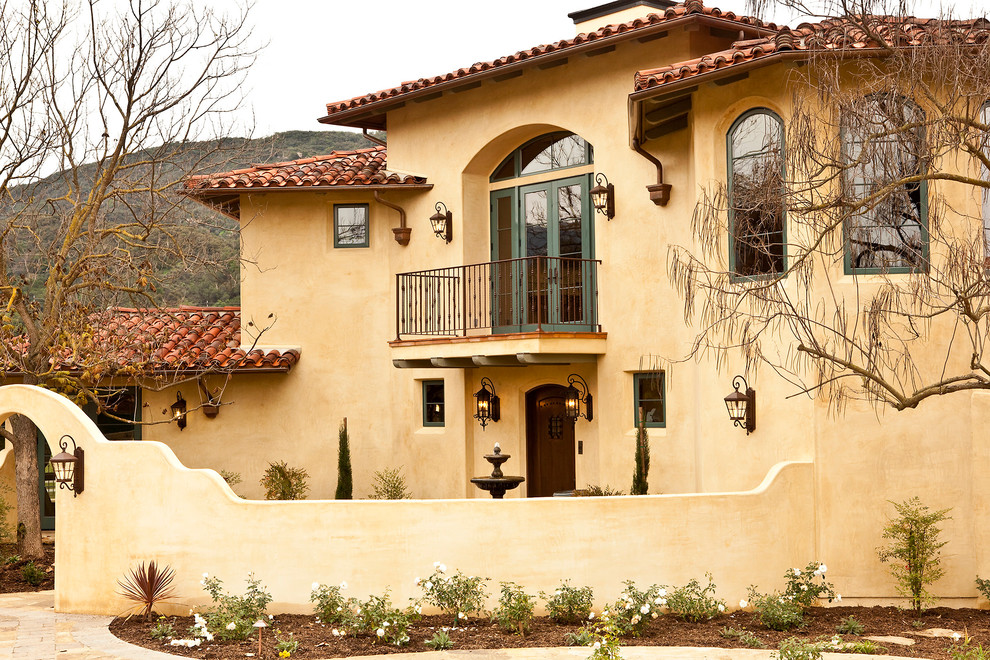 This is an example of a mediterranean two-storey exterior in Los Angeles.