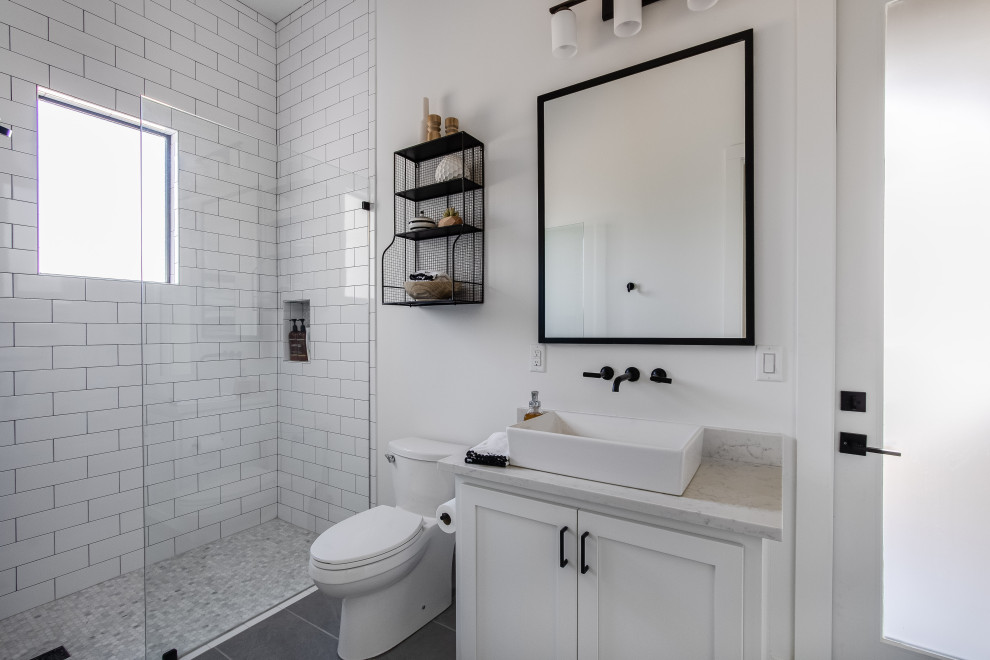 This is an example of a transitional powder room in Austin.