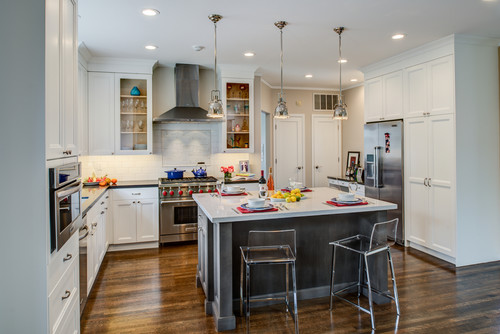 Premade kitchen cabinet in a bright transitional open-concept kitchen with warm wood finishes and modern pendant lighting.