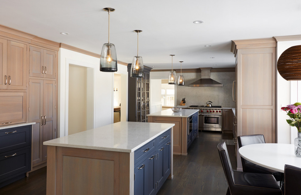 Inspiration for a medium sized classic galley kitchen in New York with shaker cabinets, engineered stone countertops, stainless steel appliances, white worktops and multiple islands.