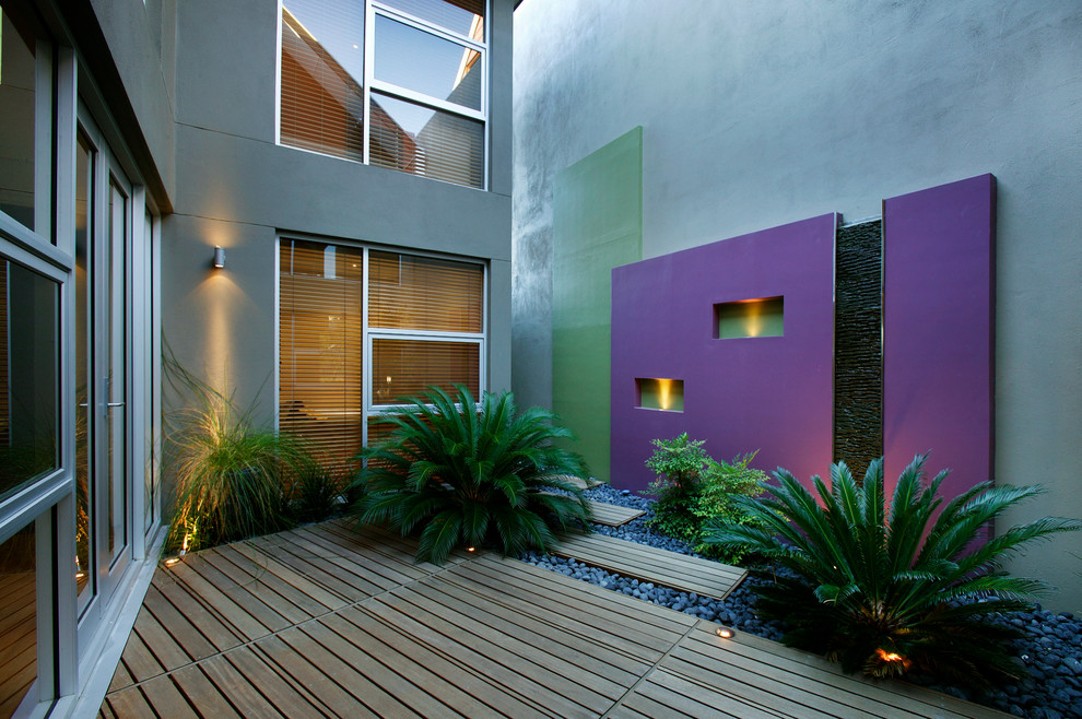 This is an example of a small contemporary courtyard patio in Perth with decking.