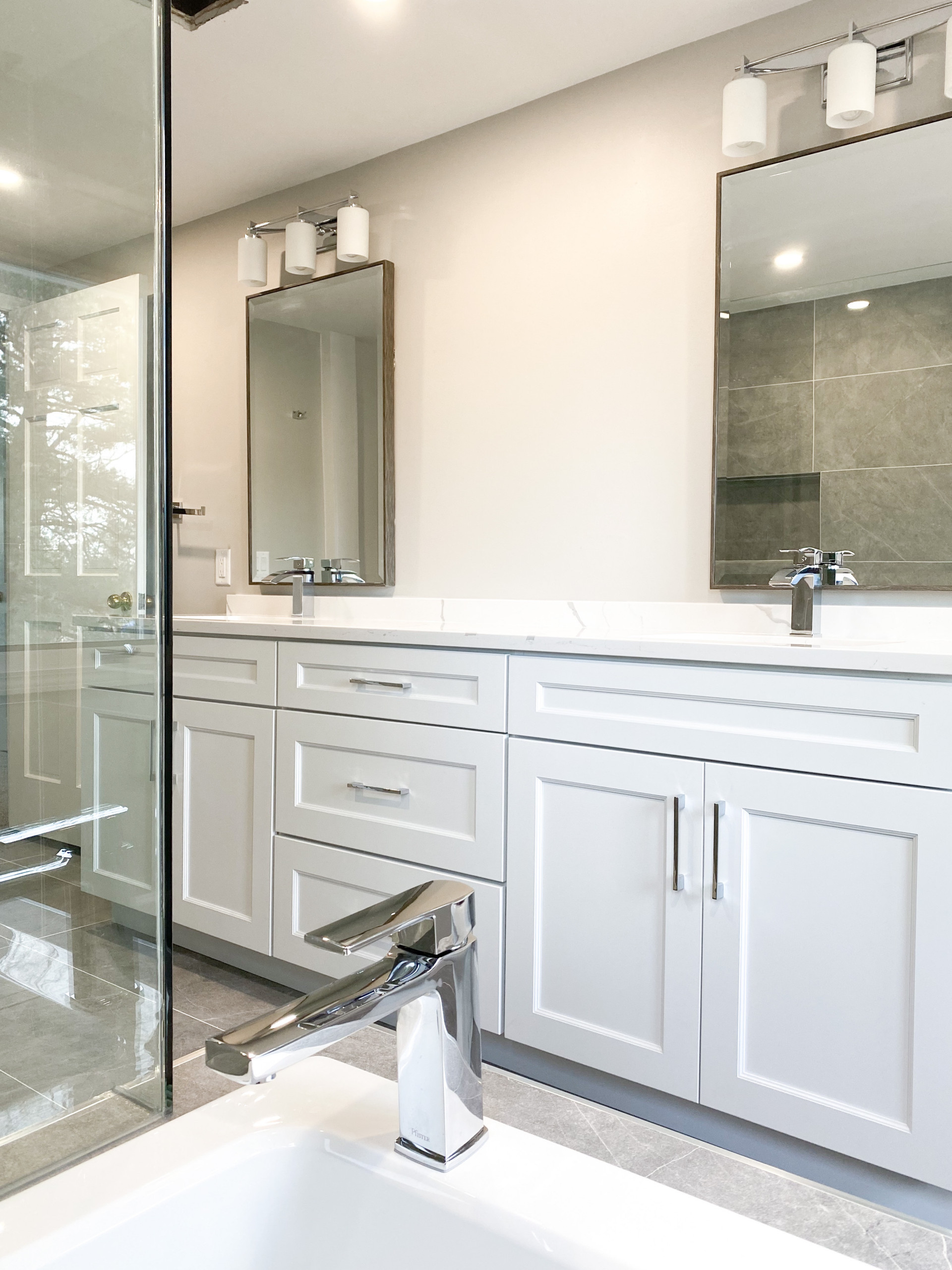 Inspiration for a large timeless porcelain tile, gray floor and double-sink bathroom remodel with shaker cabinets, gray cabinets, a one-piece toilet, white walls, an undermount sink, quartz countertop