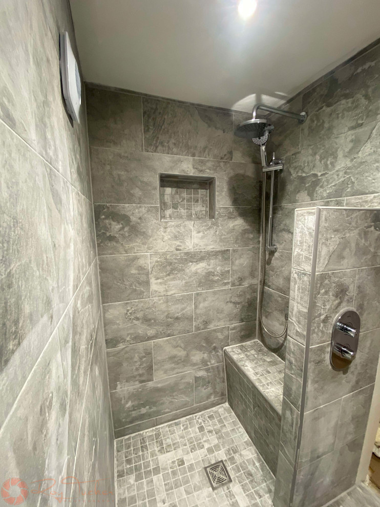 Small contemporary master bathroom in Other with a curbless shower, a two-piece toilet, gray tile, porcelain tile, grey walls, porcelain floors, a pedestal sink, grey floor, an open shower, a shower seat and a single vanity.