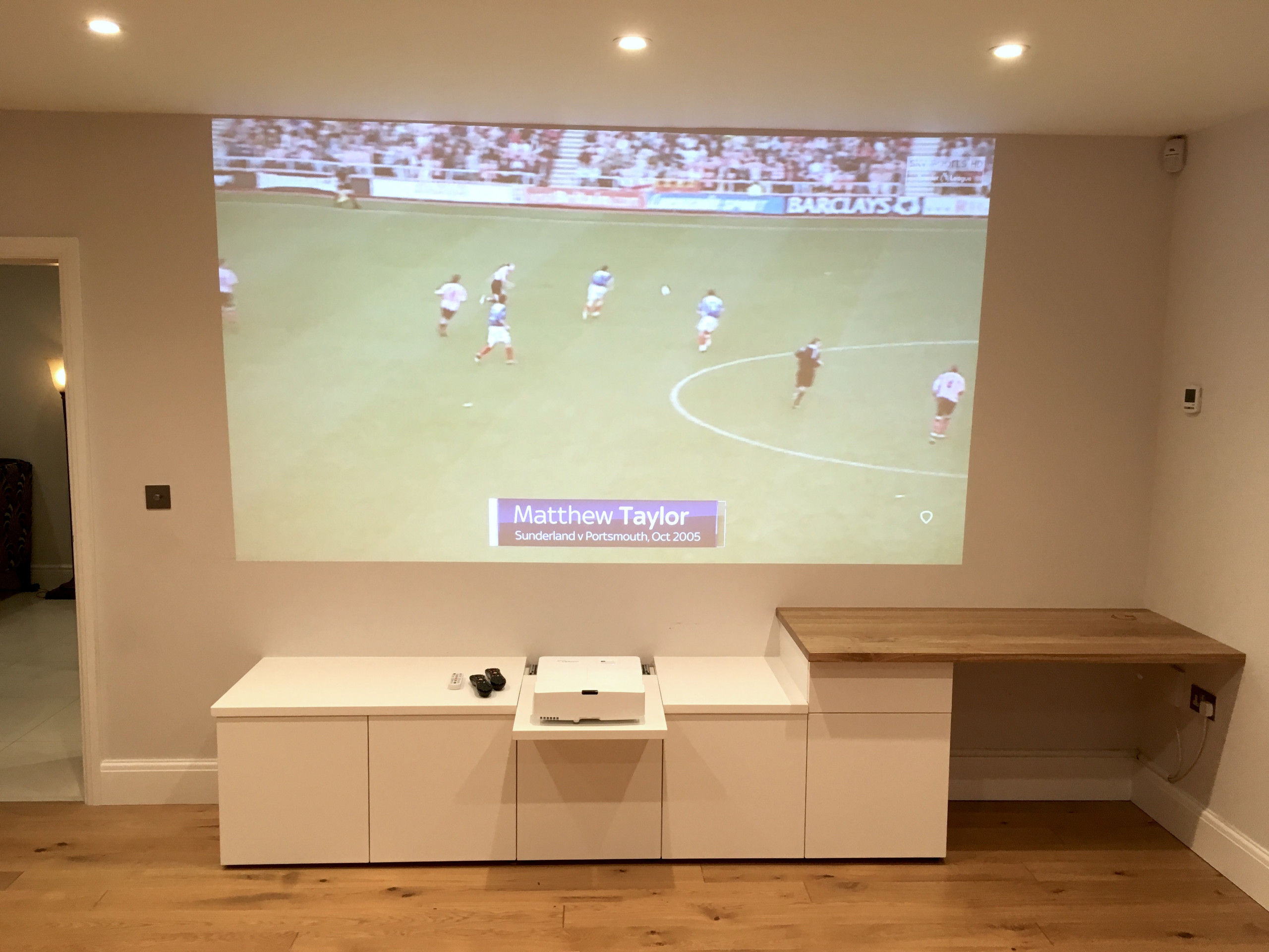 Minimalist Storage Unit with Projector and Desk