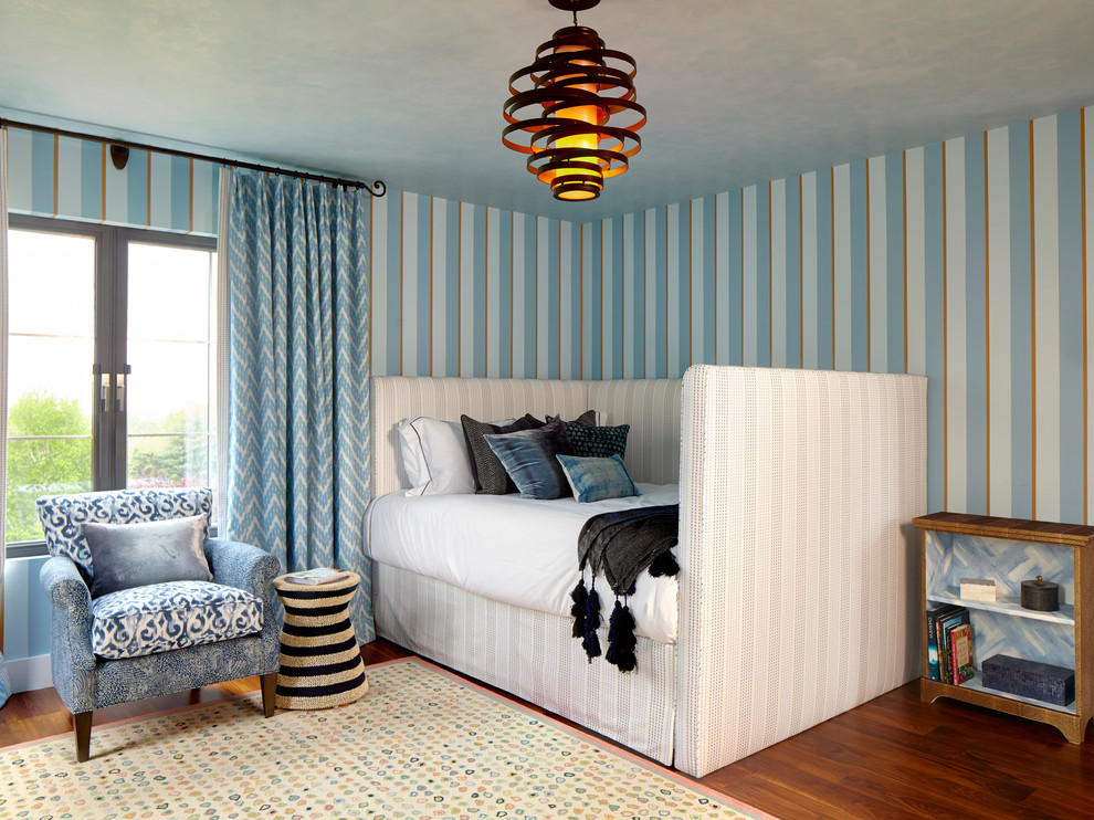 Design ideas for a mid-sized eclectic kids' room in New York with multi-coloured walls and medium hardwood floors.