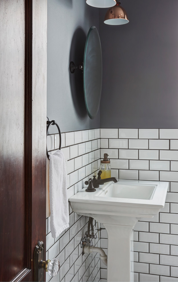 Traditional powder room in Chicago with a two-piece toilet, white tile, subway tile, grey walls, marble floors, a pedestal sink and multi-coloured floor.