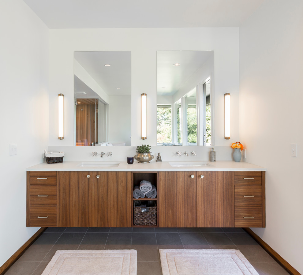 Design ideas for an expansive midcentury master bathroom in Portland with flat-panel cabinets, a freestanding tub, a double shower, white walls, porcelain floors, an undermount sink, engineered quartz benchtops, grey floor, a hinged shower door and medium wood cabinets.