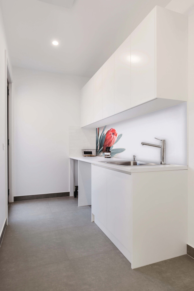 This is an example of a contemporary utility room in Sydney.