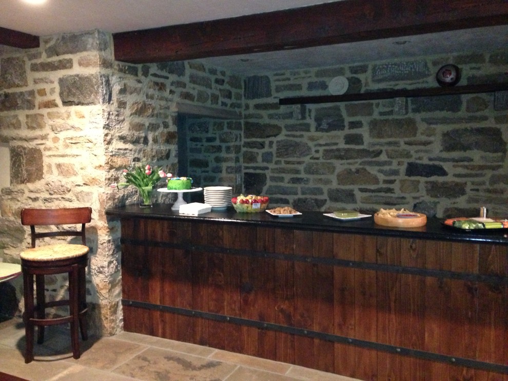Photo of a large arts and crafts single-wall wet bar in New York with limestone floors.