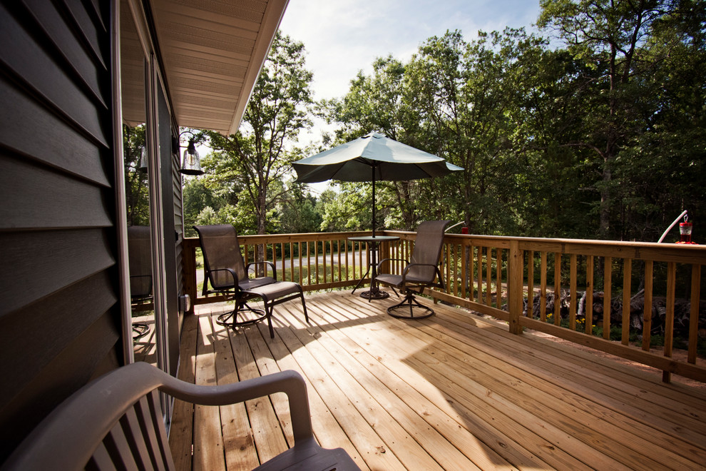 Deck - mid-sized rustic side yard deck idea with no cover