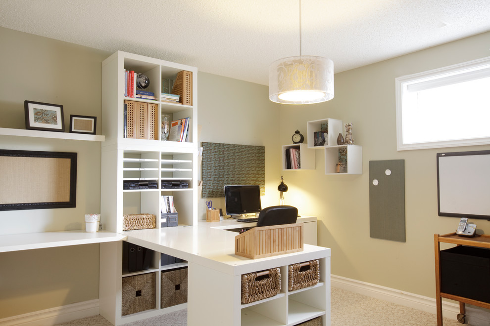 Traditional home office in Calgary with a built-in desk.